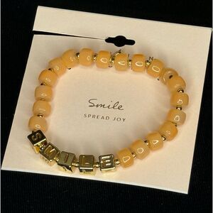 Lauren Conrad Peach Beaded Bracelet with “Smile” in Gold Beads